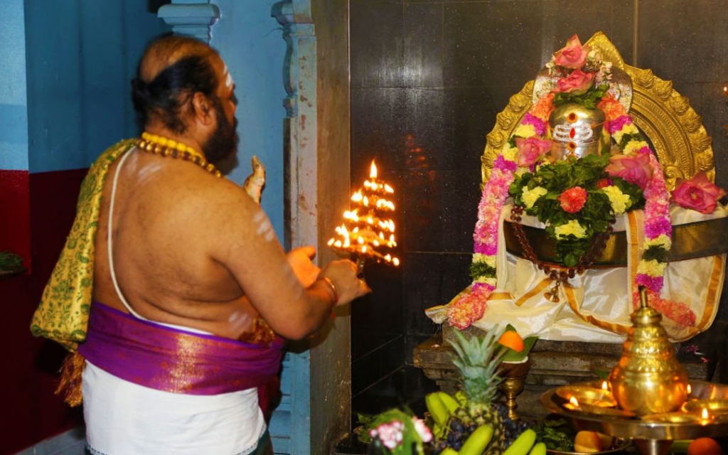 Tamil Hindu priest performs special prayers honoring Lord Shiva during the Maha Shivratri (Maha Shivaratri) festival 