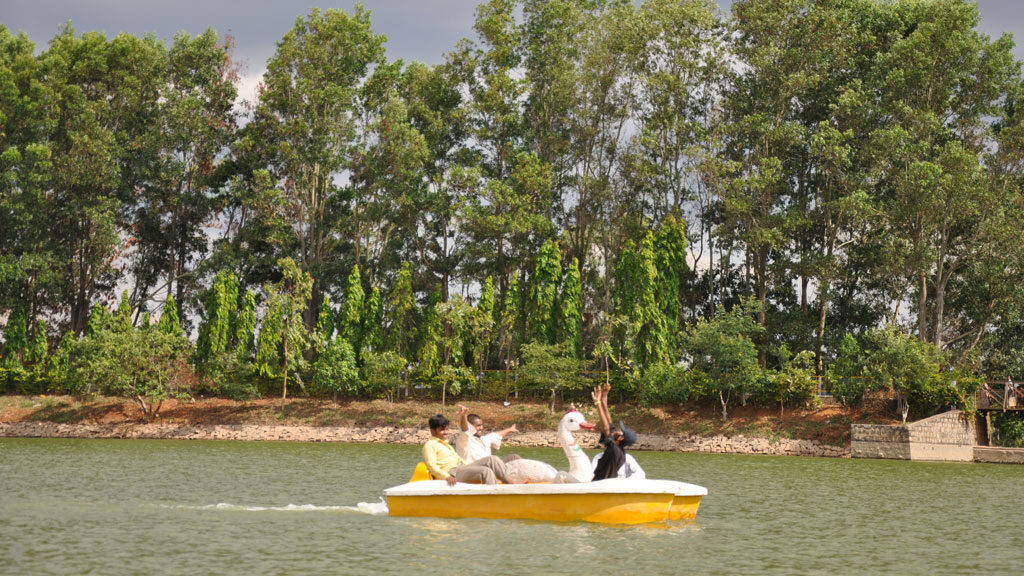 Tourists enjoying pedal boating ride at Yelagiri lake.